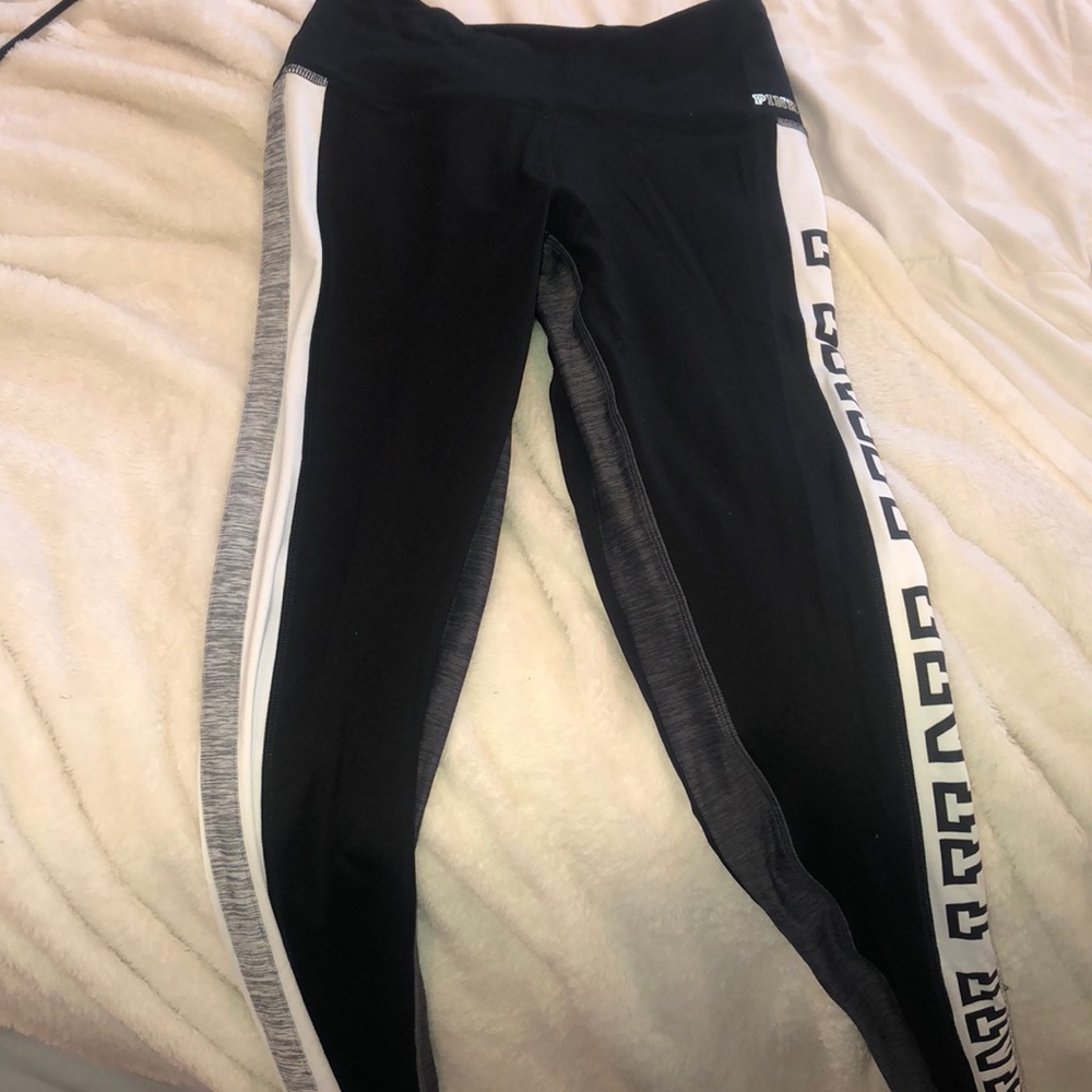 Black leggings with PINK going down the leg.